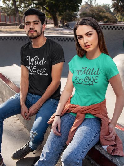 man and woman sitting in style wearing mild one wild one couple t-shirt
