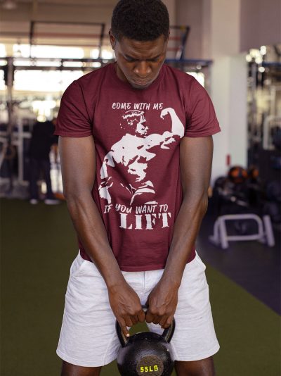man wearing Come with me if you want to Lift Arnold T-shirt and lifting weight