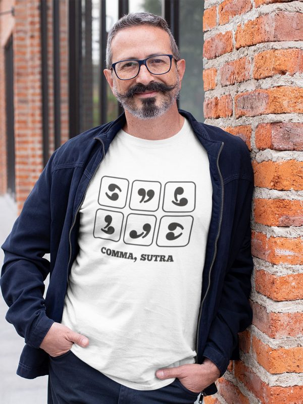 man wearing comma sutra t-shirt and smiling lightly