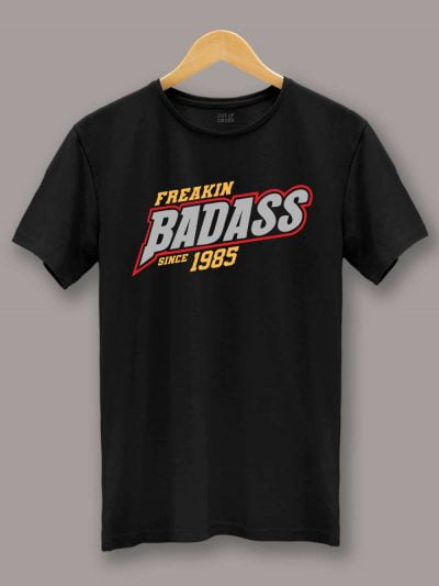 Buy Badass Since Men's Birthday T-shirt displayed on a hanger
